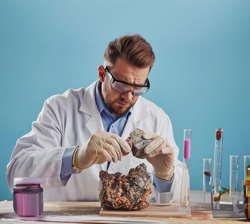 geologist analyzing rock samples laboratory scientific research